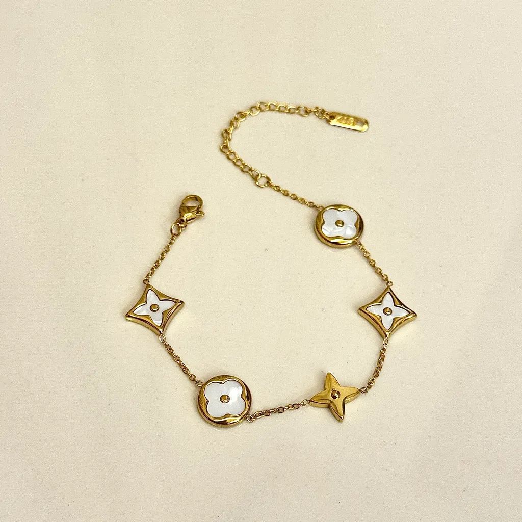Gold-Tone and Black/White Enamel Charm Link Bracelet